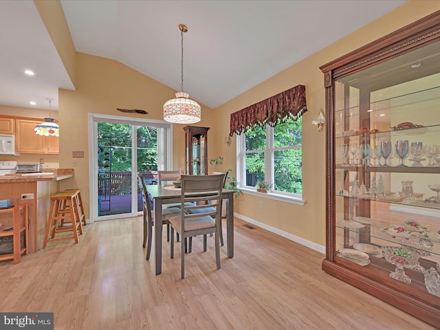 2528 Papoose Dr, Auburn, PA 17922 - dining room featuring healthy amount of natural light, light wood-type flooring, lofted ceiling, and recessed lighting