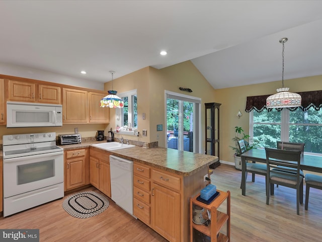 2528 Papoose Dr, Auburn, PA 17922 - kitchen with white appliances, a peninsula, light wood finished floors, vaulted ceiling, and decorative light fixtures