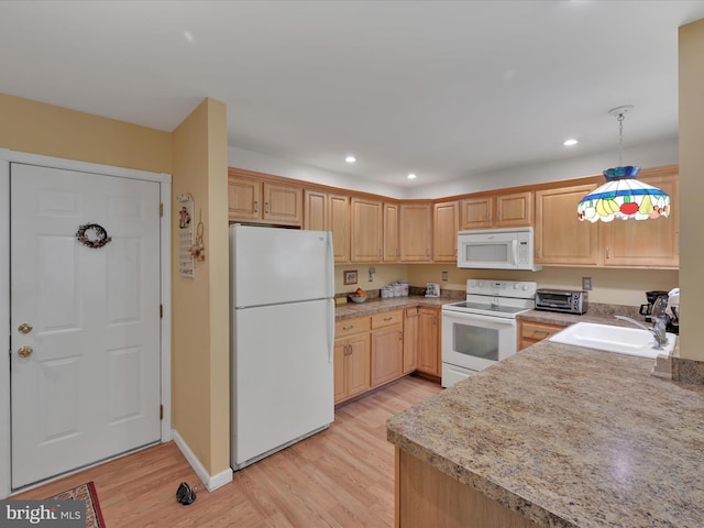 2528 Papoose Dr, Auburn, PA 17922 - kitchen featuring white appliances, light wood-type flooring, recessed lighting, light countertops, and light brown cabinets