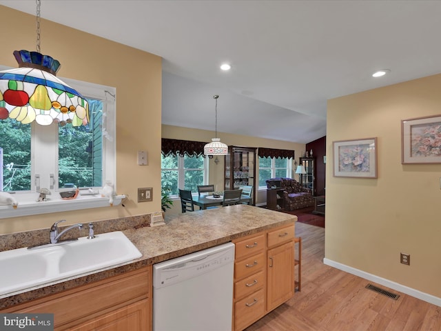 2528 Papoose Dr, Auburn, PA 17922 - kitchen with dishwasher, light wood-style flooring, pendant lighting, lofted ceiling, and recessed lighting