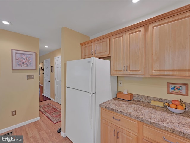 2528 Papoose Dr, Auburn, PA 17922 - kitchen with freestanding refrigerator, light brown cabinetry, light wood-style floors, light countertops, and recessed lighting