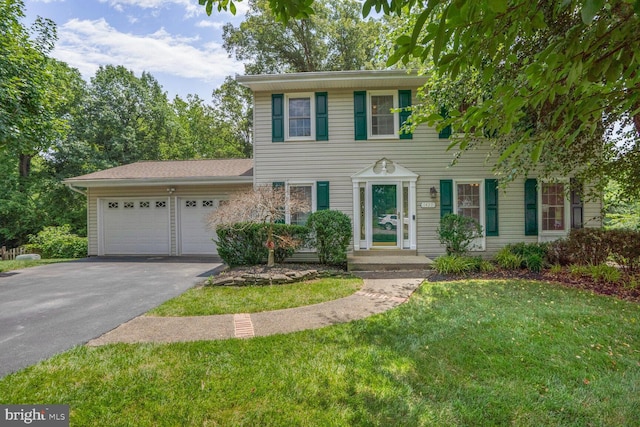 1429 Valley Mill Ct, Herndon, VA 20170 - colonial home with asphalt driveway, an attached garage, and a front lawn