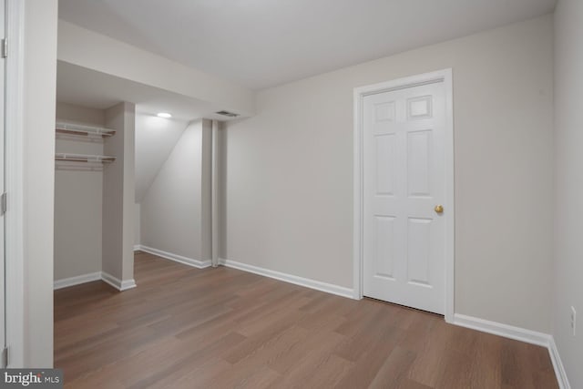 1429 Valley Mill Ct, Herndon, VA 20170 - unfurnished bedroom with wood finished floors, a closet, and recessed lighting