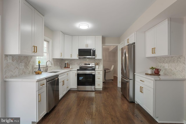 1429 Valley Mill Ct, Herndon, VA 20170 - kitchen featuring stainless steel appliances, decorative backsplash, white cabinetry, and dark wood-style floors