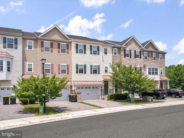 44 Munro Rd, Newark, DE 19711 - multi unit property with a garage, driveway, and stone siding