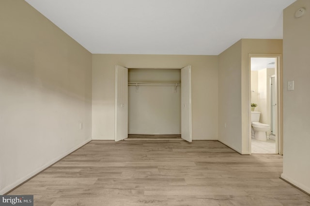 615 Center St Unit T3, Herndon, VA 20170 - unfurnished bedroom with light wood-style floors, a closet, and ensuite bathroom