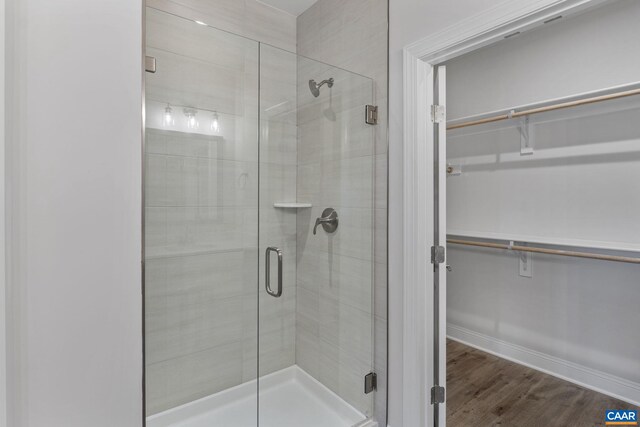 49 Ridgeline Dr, Waynesboro, VA 22980 - full bath featuring a spacious closet, a stall shower, and wood finished floors