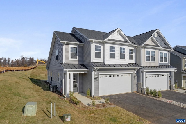 49 Ridgeline Dr, Waynesboro, VA 22980 - multi unit property with a standing seam roof, driveway, an attached garage, a front lawn, and a metal roof
