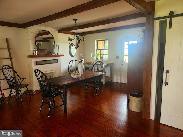 2569 White Oak Rd, Strasburg, PA 17579 - dining room featuring dark wood-type flooring, beamed ceiling, and a barn door