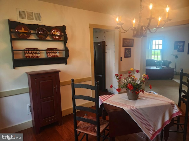 2569 White Oak Rd, Strasburg, PA 17579 - dining area featuring a chandelier and dark wood-style flooring