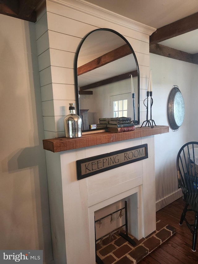 2569 White Oak Rd, Strasburg, PA 17579 - detailed view of beamed ceiling, a fireplace, and wood finished floors