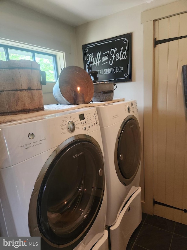 2569 White Oak Rd, Strasburg, PA 17579 - washroom featuring separate washer and dryer and dark tile patterned flooring