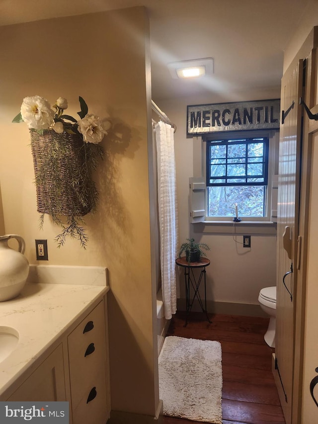2569 White Oak Rd, Strasburg, PA 17579 - bathroom with wood finished floors, vanity, and shower / bathtub combination with curtain