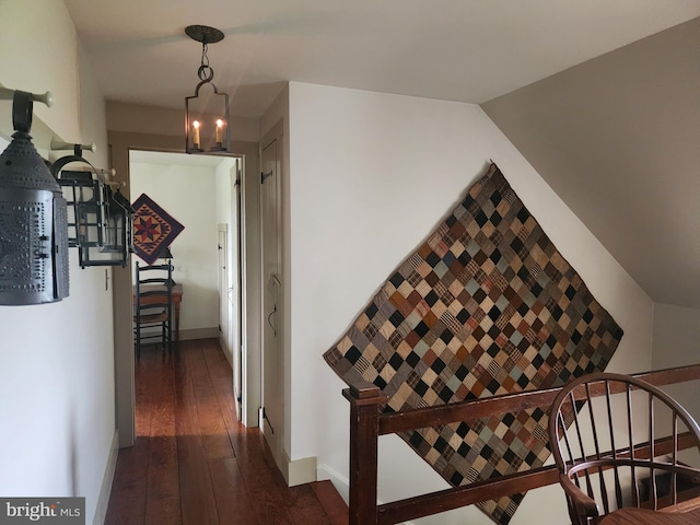 2569 White Oak Rd, Strasburg, PA 17579 - hall with dark wood finished floors, an upstairs landing, and a chandelier