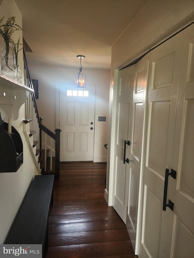 2569 White Oak Rd, Strasburg, PA 17579 - entrance foyer featuring dark wood-type flooring, stairs, and a chandelier