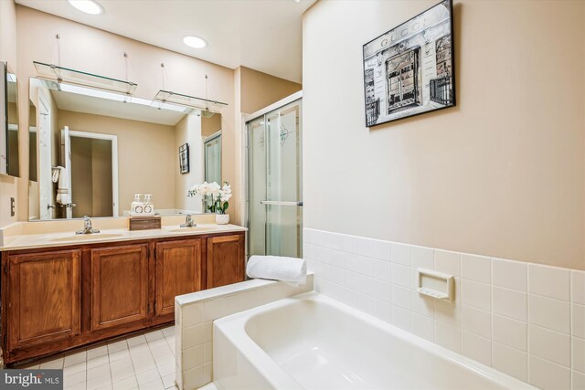 14329 Long Channel Dr, Germantown, MD 20874 - full bath with a garden tub, double vanity, a stall shower, and tile patterned floors