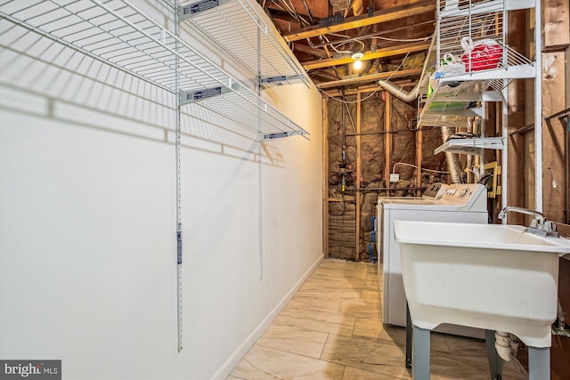 14329 Long Channel Dr, Germantown, MD 20874 - unfinished below grade area featuring washer and clothes dryer and a sink