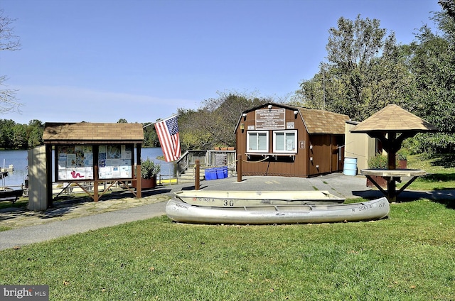 14329 Long Channel Dr, Germantown, MD 20874 - view of front of property with a storage shed, a front lawn, and a gambrel roof