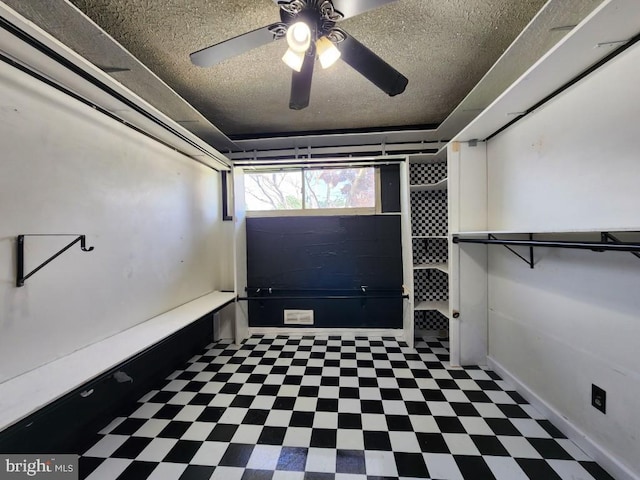 6222 Catalpha Rd, Baltimore, MD 21214 - laundry room featuring tile patterned floors, a textured ceiling, and ceiling fan