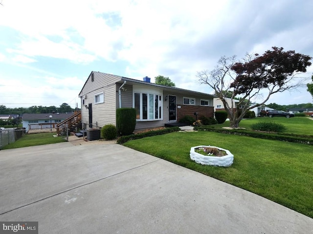 6222 Catalpha Rd, Baltimore, MD 21214 - single story home with a front lawn and a chimney