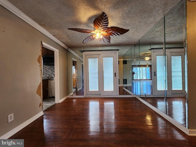 6222 Catalpha Rd, Baltimore, MD 21214 - unfurnished room with a ceiling fan, wood finished floors, a textured ceiling, and ornamental molding