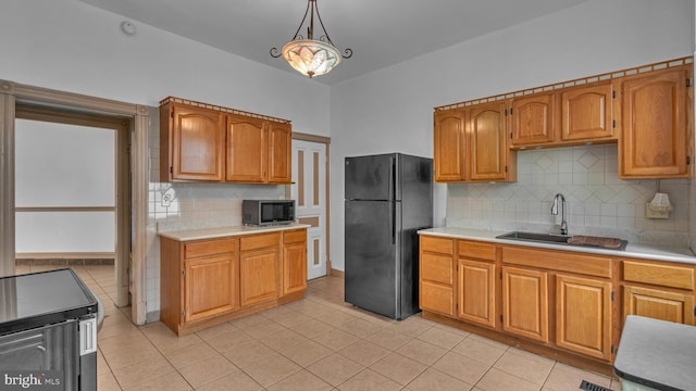 501 W 4th St, Bethlehem, PA 18015 - kitchen with appliances with stainless steel finishes, light countertops, and decorative backsplash