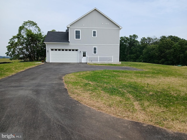 1909 Hughes Shop Rd, Westminster, MD 21158 - view of property exterior with asphalt driveway, a lawn, and a garage