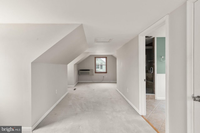 2216 Gaylawn Dr, Halethorpe, MD 21227 - additional living space featuring an AC wall unit, attic access, lofted ceiling, and light carpet