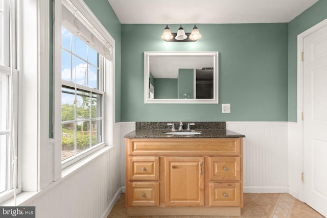 2216 Gaylawn Dr, Halethorpe, MD 21227 - bathroom featuring wainscoting, vanity, and a chandelier