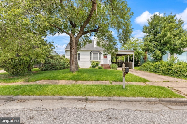2216 Gaylawn Dr, Halethorpe, MD 21227 - view of front of home with a front yard, concrete driveway, and a carport