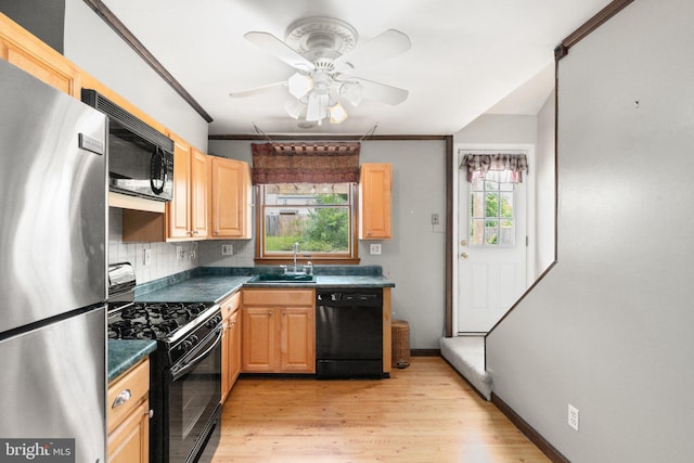 2216 Gaylawn Dr, Halethorpe, MD 21227 - kitchen featuring black appliances, dark countertops, ceiling fan, light wood-style flooring, and light brown cabinetry