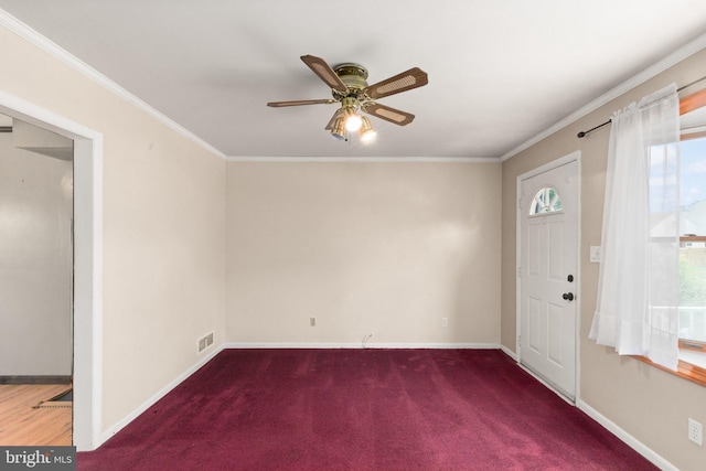 2216 Gaylawn Dr, Halethorpe, MD 21227 - carpeted foyer with plenty of natural light, a ceiling fan, and ornamental molding