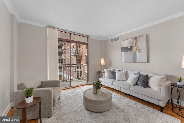 1205 N Garfield St Unit 711, Arlington, VA 22201 - living area featuring crown molding, wood finished floors, and expansive windows