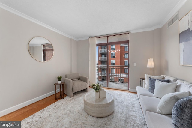 1205 N Garfield St Unit 711, Arlington, VA 22201 - living room featuring crown molding, wood finished floors, and floor to ceiling windows