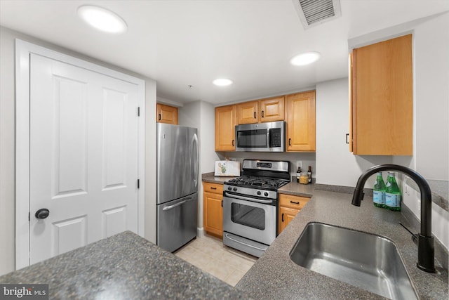 1205 N Garfield St Unit 711, Arlington, VA 22201 - kitchen with stainless steel appliances, recessed lighting, dark stone countertops, and light tile patterned floors