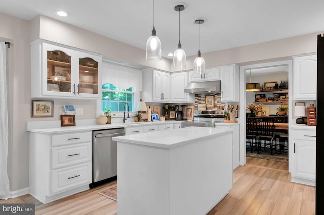12513 Dardanelle Ct, Herndon, VA 20170 - kitchen featuring appliances with stainless steel finishes, under cabinet range hood, white cabinets, glass insert cabinets, and light wood finished floors