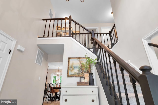 12513 Dardanelle Ct, Herndon, VA 20170 - staircase featuring a chandelier and a high ceiling