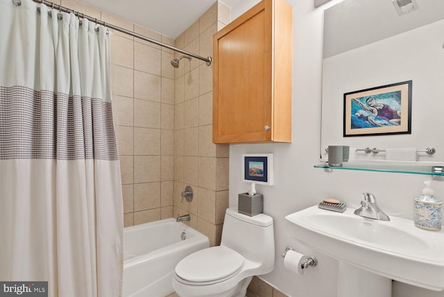 2328 Champlain St NW Unit 101, Washington, DC 20009 - bathroom with shower / bath combo with shower curtain and toilet