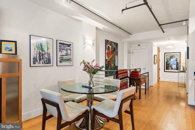 2328 Champlain St NW Unit 101, Washington, DC 20009 - dining space with light wood-style flooring and baseboards
