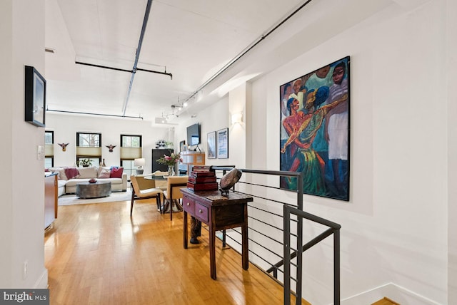 2328 Champlain St NW Unit 101, Washington, DC 20009 - hallway featuring wood finished floors and track lighting