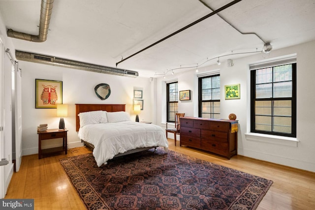 2328 Champlain St NW Unit 101, Washington, DC 20009 - bedroom featuring light wood-style flooring and track lighting