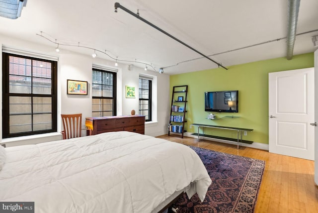 2328 Champlain St NW Unit 101, Washington, DC 20009 - bedroom with wood finished floors and track lighting