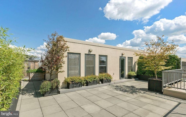 2328 Champlain St NW Unit 101, Washington, DC 20009 - rear view of house featuring stucco siding and a patio area