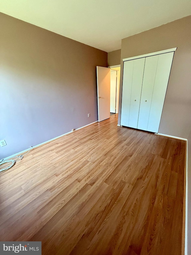 301 Byberry Rd Unit H10, Philadelphia, PA 19116 - unfurnished bedroom featuring wood finished floors and a closet