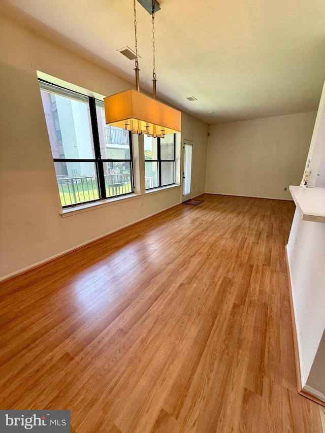 301 Byberry Rd Unit H10, Philadelphia, PA 19116 - unfurnished living room featuring light wood finished floors and baseboards