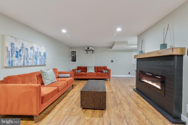 11726 Lariat Ln, Oakton, VA 22124 - living room with a glass covered fireplace, light wood-style floors, and recessed lighting