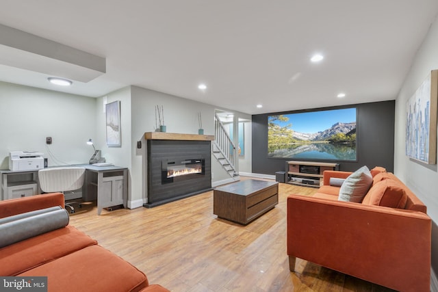 11726 Lariat Ln, Oakton, VA 22124 - living area featuring light wood finished floors, a glass covered fireplace, recessed lighting, and a desk