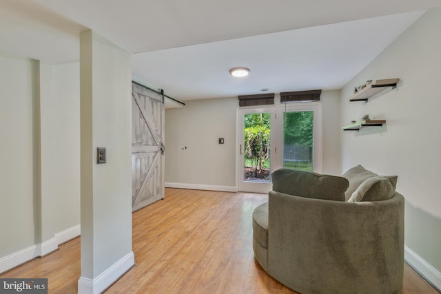 11726 Lariat Ln, Oakton, VA 22124 - living area with a barn door and light wood-style flooring