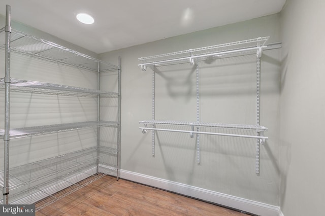 11726 Lariat Ln, Oakton, VA 22124 - walk in closet with wood finished floors