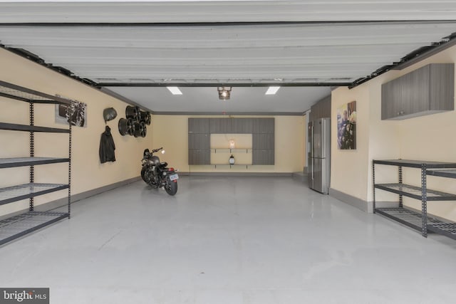 11726 Lariat Ln, Oakton, VA 22124 - garage with freestanding refrigerator and baseboards